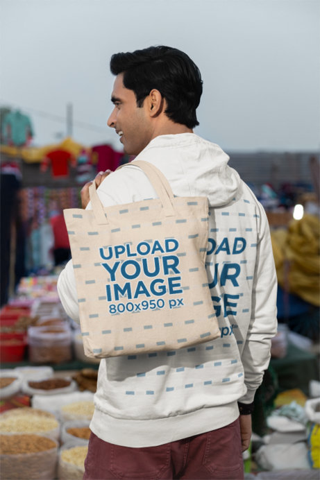 Back-View Mockup Featuring a Man Carrying a Tote Bag over His Shoulder at a Market