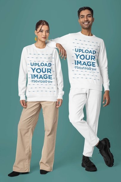 Crewneck Sweatshirt Mockup of a Man and a Woman Wearing Matching Outfits in a Studio 
