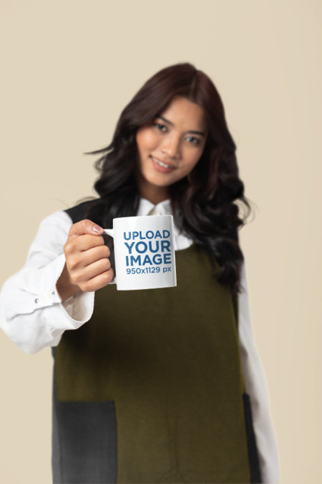 11 Oz Coffee Mug Mockup Featuring a Smiling Woman in a Studio