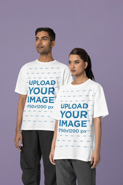 Blinkstore T-Shirt Mockup Featuring a Serious Man and Woman Posing in a Studio
