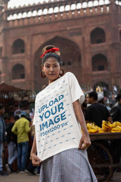 Blinkstore T-Shirt Mockup of a Woman Posing by a Street Market