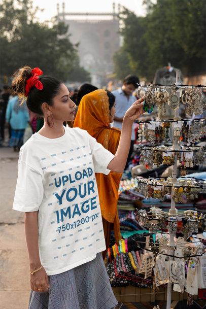 Oversized Blinkstore Tee Mockup of a Woman Shopping at a Street Market m37430