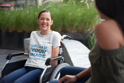 T-Shirt Mockup of a Happy Woman Sitting on a Wheelchair