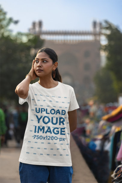 Mockup Featuring a Woman Wearing a Scott International T-Shirt at an Urban Market