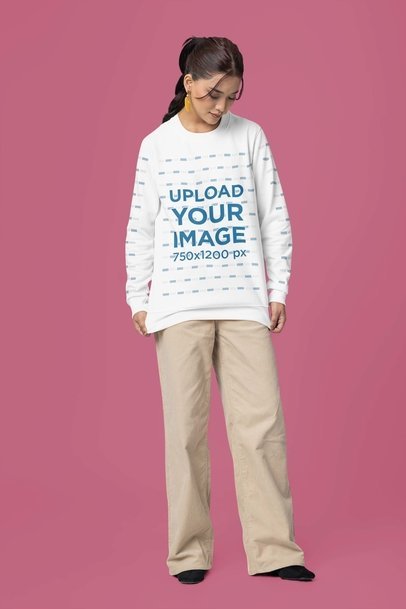 Sweatshirt Mockup of a Serious Woman Standing Against a Customizable Background