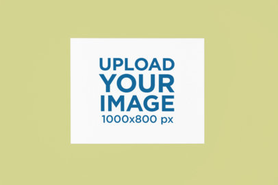 Mockup of a Horizontal Canvas Art Print Placed on a Colored Surface m37135