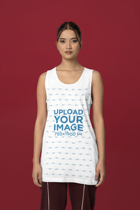 Fabious Tank Top Mockup Featuring a Serious Woman Posing in a Studio for an E-Shop Catalog