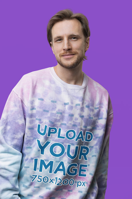 Mockup of a Smiling Man Wearing a Tie-Dye Sweatshirt from Colortone in a Studio