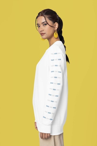 Mockup of a Woman with Colorful Earrings Wearing a Sweatshirt in a Studio m37745
