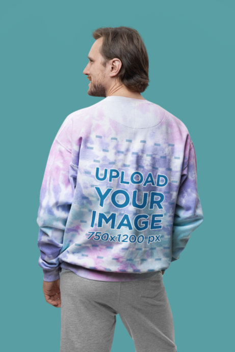 Back-View Mockup Featuring a Man Wearing a Colortone Tie-Dye Sweatshirt in a Studio