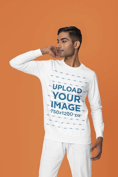 Mockup Featuring a Man Posing in a Studio Wearing a Crewneck Sweatshirt