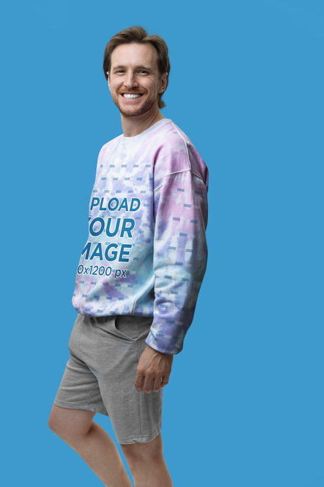 Mockup of a Smiling Man Wearing a Tie-Dye Colortone Sweatshirt with a Customizable Sleeve