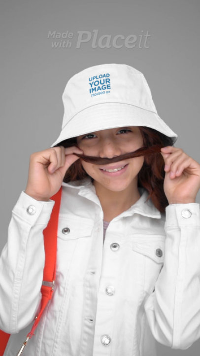 Bucket Hat Video Featuring a Girl Making a Funny Face With Her Hair