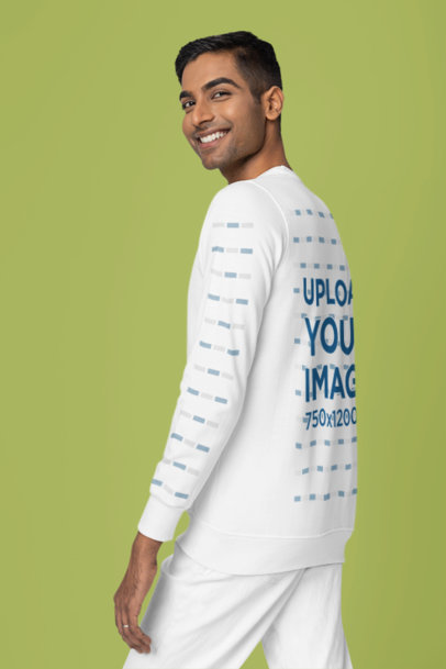 Mockup of a Smiling Man Wearing a Round-Neck Sweatshirt in a Studio