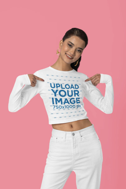 Mockup Featuring a Woman Pointing at Her New Long-Sleeved Crop Top from The Blazze