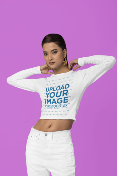 The Blazze Long Sleeve Crop Top Mockup Featuring a Woman Posing in a Studio