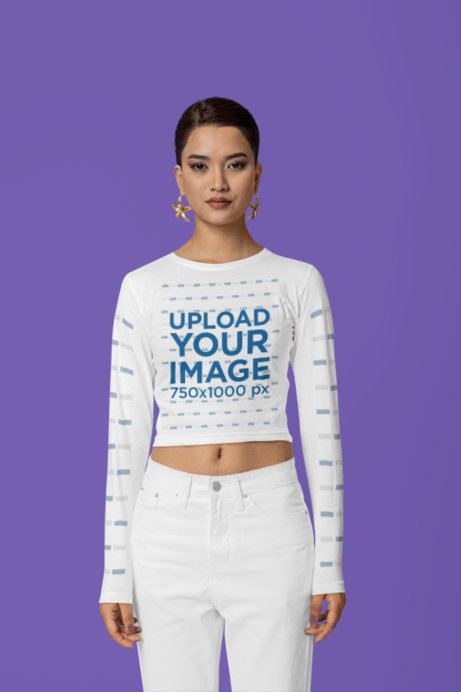 The Blazze Long-Sleeve Crop Top Mockup Featuring a Woman in a Studio