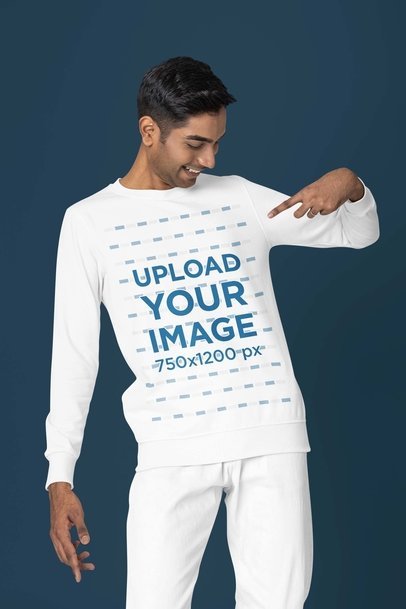 Mockup of a Joyful Man in a Studio Pointing at His New Round-Neck Sweatshirt 