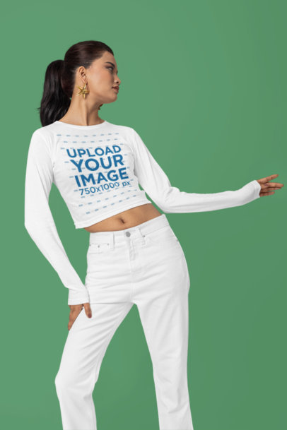 The Blazze Long-Sleeve Crop Top Mockup Featuring a Woman Standing in a Studio m37669