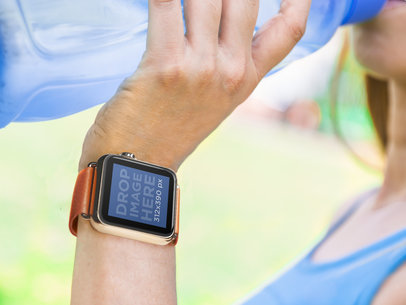 Girl Working Out And Drinking Water With Apple Watch Stock Photo
