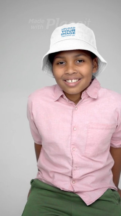 Bucket Hat Video Featuring a Smiling Boy in a Studio