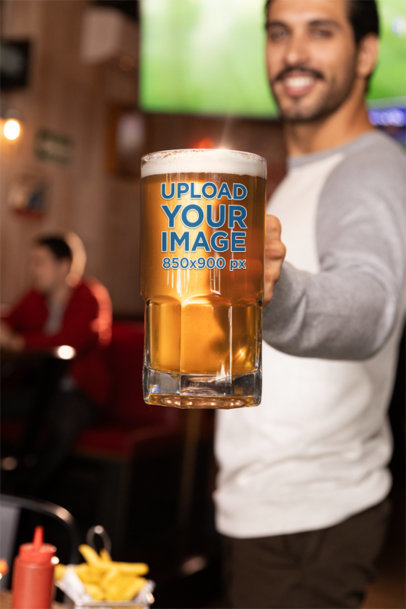 Beer Glass Mockup Featuring a Smiling Man in a Sports Bar m38073