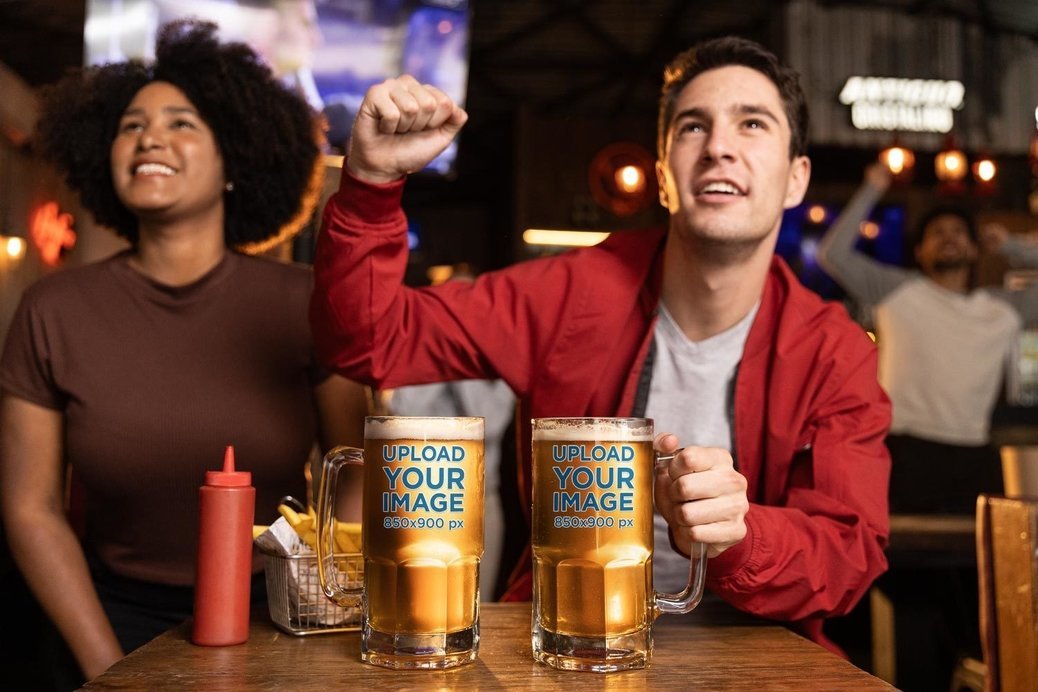 Beer Glass Mockup Featuring a Man and Woman Cheering for a Game in a Sports Bar