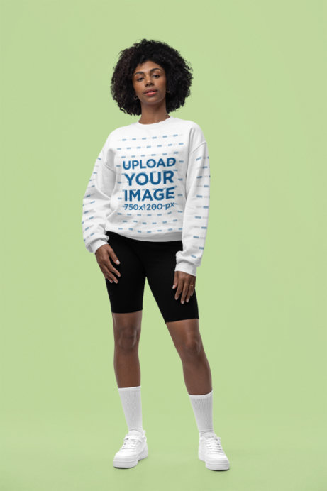 Mockup of a Woman with an Afro Hairstyle Wearing a Pullover Hoodie from Gildan in a Studio