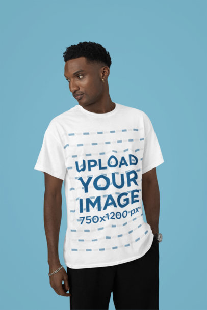 Round-Neck T-Shirt Mockup Featuring a Serious Man Standing in a Studio