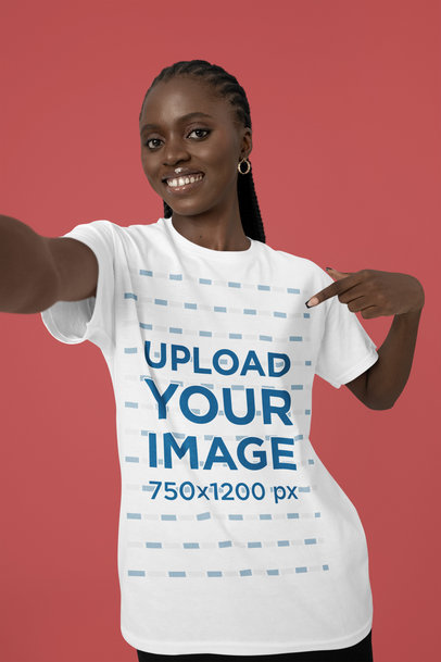 Mockup of a Smiling Woman Taking a Selfie As She Points To Her New T-Shirt