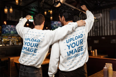 Back-View Gildan Sweatshirt Mockup Featuring Two Men Watching a Sports Match