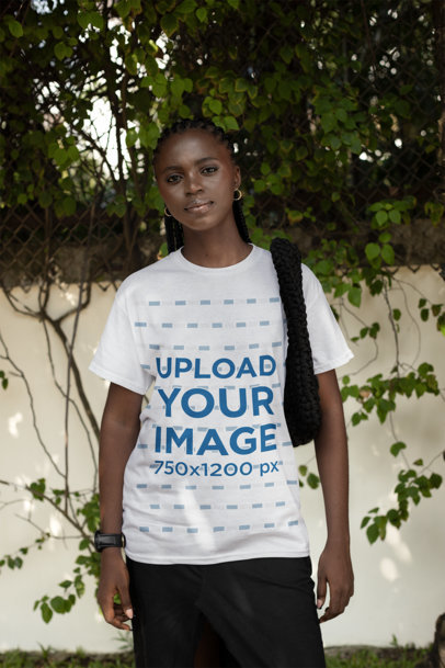 Round-Neck T-Shirt Mockup Featuring a Serious Woman Posing With a Purse