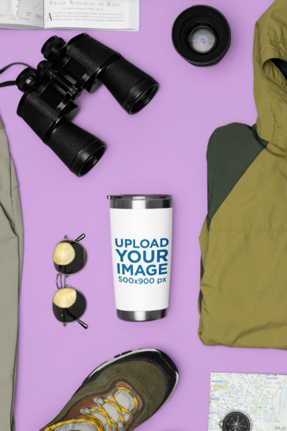 Mockup of a Travel Mug Next to Binoculars and Sunglasses m37469
