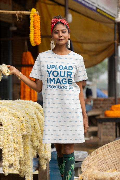 Sublimated T-Shirt Dress Mockup Featuring a Happy Woman Posing in a Street Market