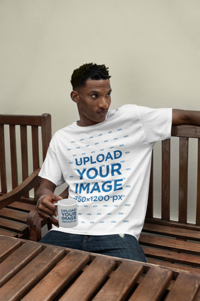 T-Shirt Mockup Featuring a Man Holding a Coffee Mug While Sitting on a Bench m37895