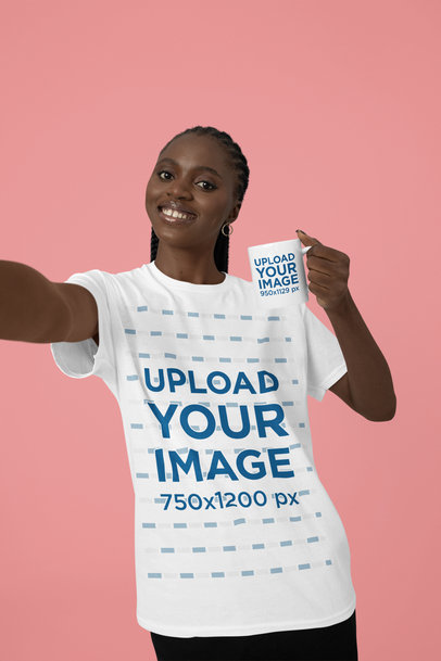 T-Shirt Mockup of a Happy Woman Taking a Selfie While Holding a Coffee Mug in a Studio m37913