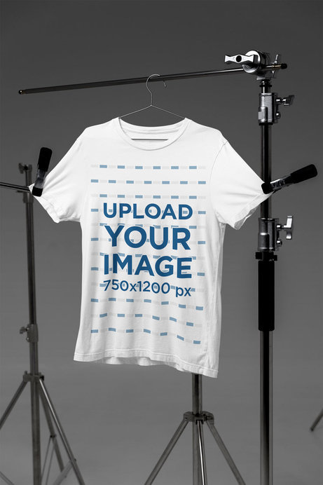 Mockup Featuring a Bella Canvas Round-Neck Tee Placed on Photography Tripods