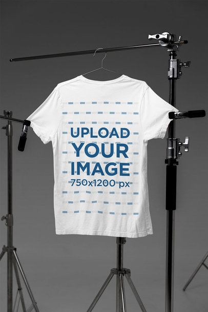 Mockup of a Bella Canvas T-Shirt Hanged on Professional Photography Tripods m37615