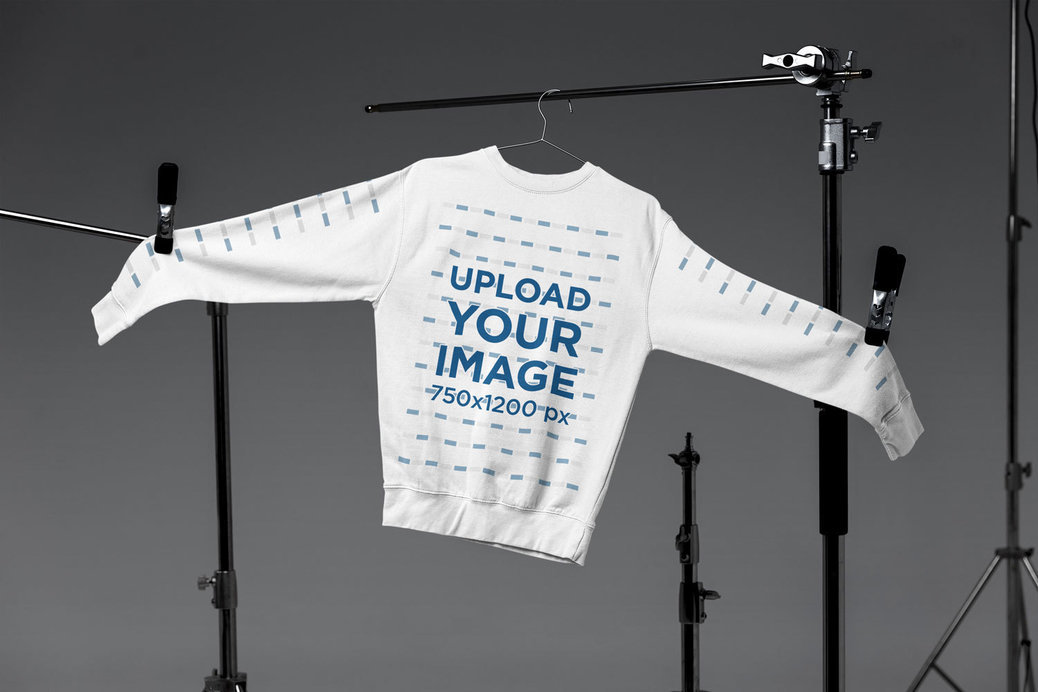 Mockup of a Crewneck Sweatshirt from Cotton Heritage Placed in an Industrial Setting