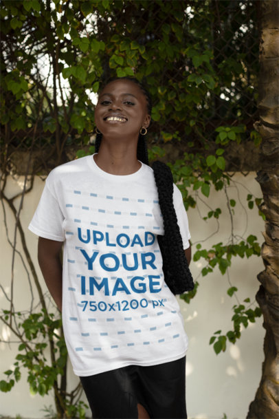 Round-Neck T-Shirt Design Maker of a Cheerful Woman Posing Near a Tree 