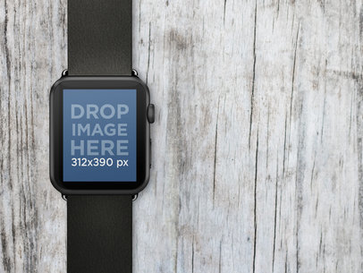 Mockup of a Black Apple Watch Over Wooden Surface Stock Photo