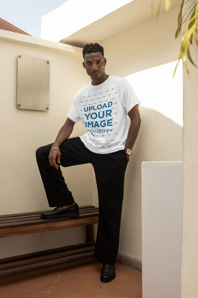 T-Shirt Mockup of a Serious Man Posing on a Bench