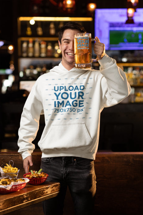 Gildan Hoodie Mockup of a Smiling Man Holding a Beer Glass Close to His Face