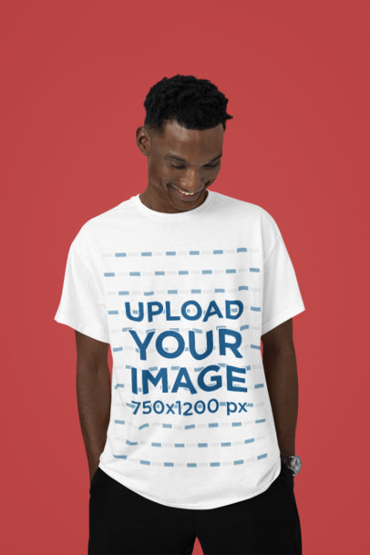 Round-Neck T-Shirt Mockup of a Smiling Man Posing Against a Colorful Surface