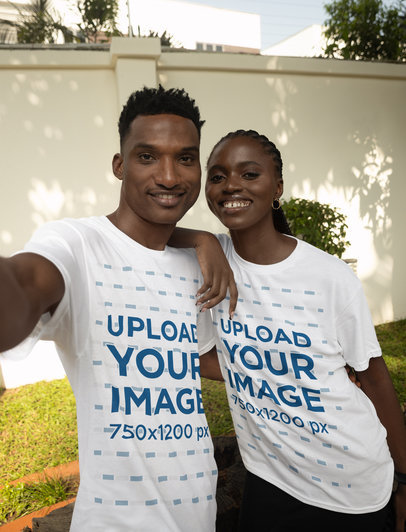 T-Shirt Mockup of a Cheerful Couple Taking a Selfie in a Backyard m37914