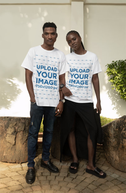 T-Shirt Mockup Featuring a Serious Couple Posing in a Backyard
