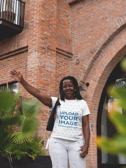 Mockup of a Woman Wearing a T-Shirt while Hailing a Taxi
