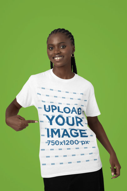 Mockup of a Happy Woman Pointing at Her Round-Neck Tee in a Studio