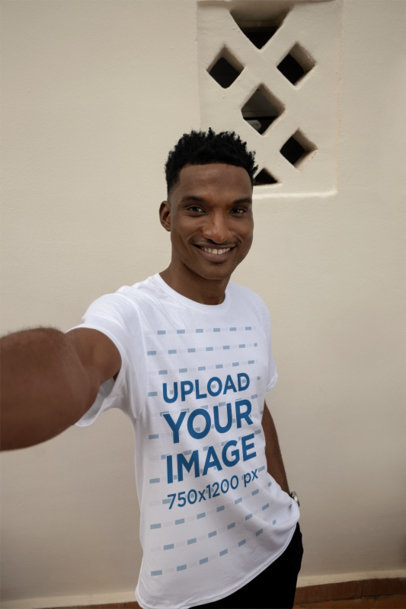 Round-Neck Tee Mockup Featuring a Cheerful Man Taking a Selfie