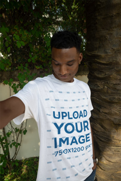 Round-Neck T-Shirt Mockup Featuring a Smiling Man Taking a Selfie